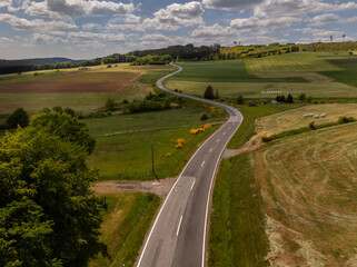 Winding Roads Through the Forested Hills of the Eifel, Germany near Salm – Aerial Shot
