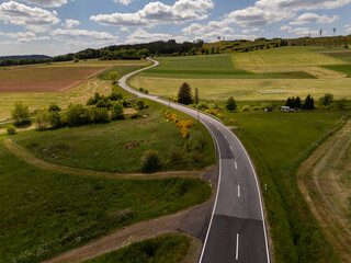 Winding Roads Through the Forested Hills of the Eifel, Germany near Salm – Aerial Shot