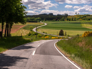 Winding Roads Through the Forested Hills of the Eifel, Germany near Salm – Aerial Shot