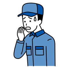 動揺しているつなぎ作業服の男性