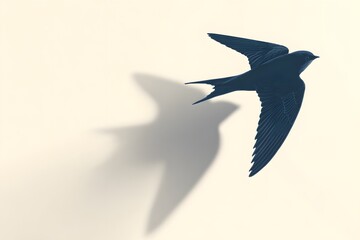 Obraz premium a bird swiftly soaring through the air casting shadow. The bird, depicted in a navy blue hue, extends its wings wide, symbolizing freedom
