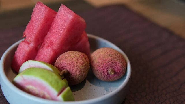 dessert on a plate lychee watermelon and guava serving in a restaurant dessert at the end of a meal seasonal fruits. Vietnam in spring