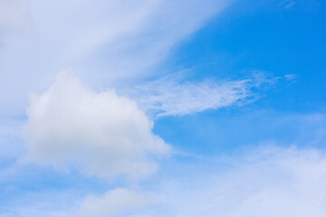 Beautiful cloud formations gather across a vivid blue sky, creating a stunning and peaceful natural backdrop.