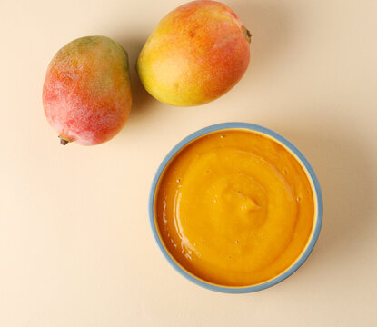 Indian Food - Aamras is a sweet dish made from the pulp of the Alphonso mango fruit. Served with hot puri/poori. Sweet Mango puree garnished with Kashmiri Saffron. Aam Ras Puri OR Alphonso Mango pulp