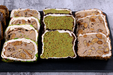 Assortment of sliced ​​Turkish delight with cream filling, pistachio, almond, hazelnut on a...