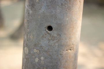 A small hole in cement pool