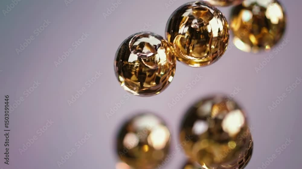Poster close-up, blurred shot of floating golden spheres against a soft background, creating a dreamy, abst