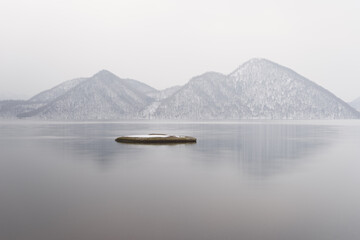 lake and mountains in winter