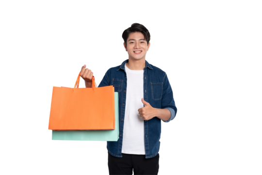 Portrait of young Asian man holding shopping bag posing on PNG background