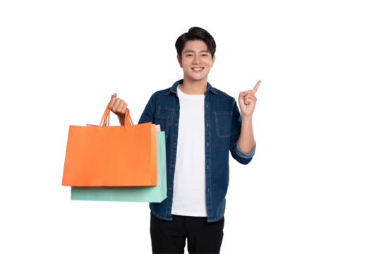 Portrait of young Asian man holding shopping bag posing on PNG background