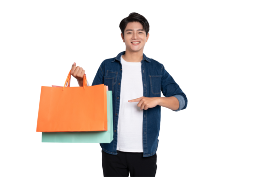 Portrait of young Asian man holding shopping bag posing on PNG background