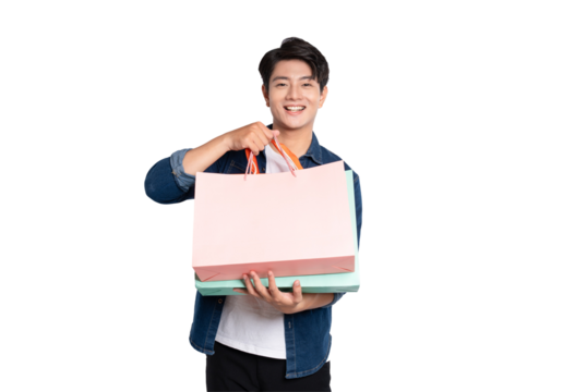Portrait of young Asian man holding shopping bag posing on PNG background