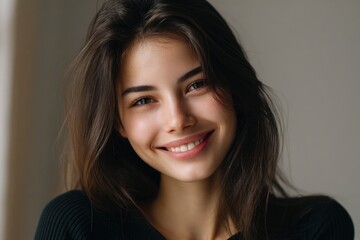 Fototapeta premium Smiling Woman Portrait: Natural Beauty, Soft Light, Warm Mood