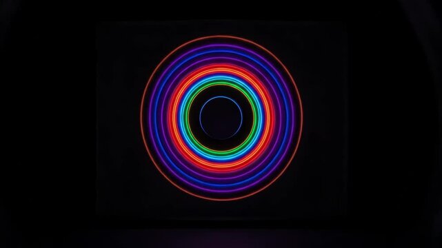 Spiral pattern slowly rotating on a screen in a dark room  