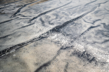 Salt crystals form naturally in shallow pools under sunlight and wind. Village fields with active evaporation, seawater channeled for drying, small scale export, natural resource and sustainability