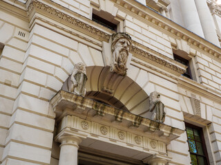 Sculptures on exterior of HM Treasury government department building, London, UK