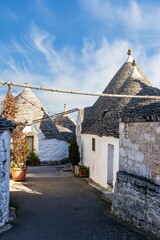 wonderful white mediterranean architecture of italian buildings with sdtrange conic roofs and wfite...