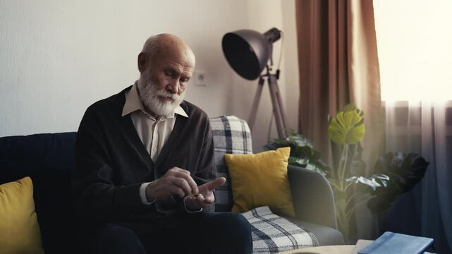 Portrait of grandfather counting coins, vulnerable pensioner in financial crisis