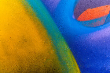 Beautiful brick wall colorful street art graffiti background. Abstract creative spray drawing...