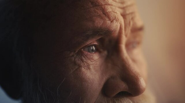 Hopeless senior man deeply crying alone, overwhelmed by loss and loneliness