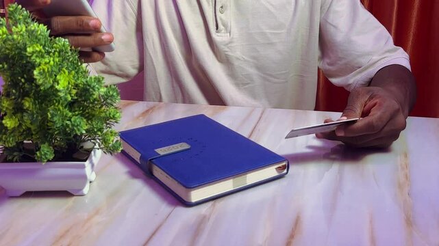 man using bank card for shopping online using mobile phone technology