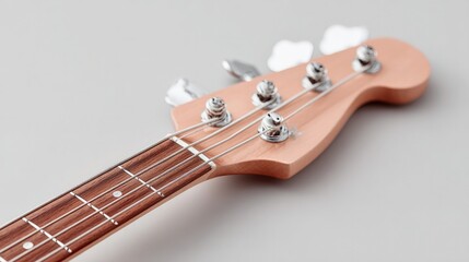 minimalistic close-up of bass guitar neck against light background