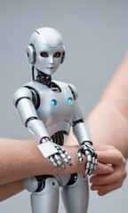 Humanoid Robot Grasped by Arm of Unspecified Ethnicity