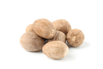 Pile of fresh nutmegs isolated on white