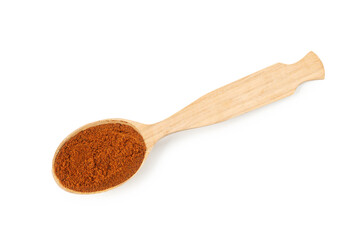 Nutmeg powder in spoon isolated on white, top view