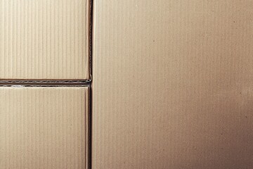 Top view reveals a close up of joined brown cardboard sheets in sections