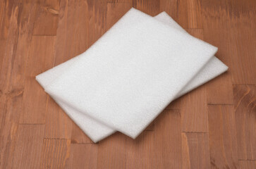 Two white foam sheets