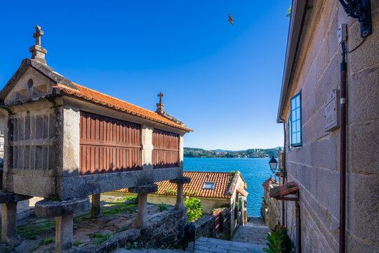 Iconic horreos and traditional architecture in Combarro, a charming Galician village in Pontevedra, Spain. The site dates back to the 12th century and is a symbol of cultural heritage.