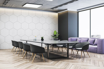 Modern empty corporate meeting room with geometric wall design, sleek furniture, and large window...