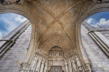  Intricate portico of Santa Maria Cathedral in Tui, Spain, a pioneering example of Iberian Gothic...