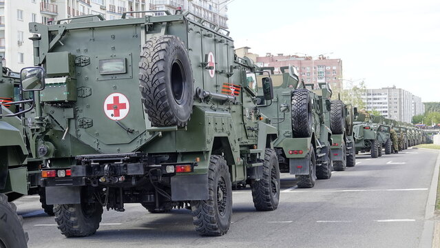 Minsk, Belarus - 9.05.2025: A huge army convoy of medical vehicles for evacuating the wounded with red crosses on their sides