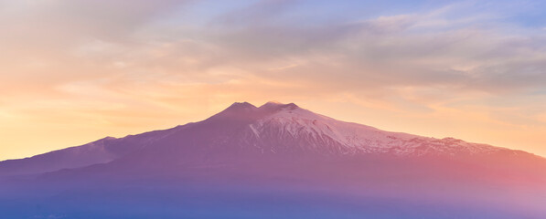 highland mountain landscape of beautiful sunset or sunrise with nice mountain peaks and slopes, green and golden hills and majestic cloudy sky on background