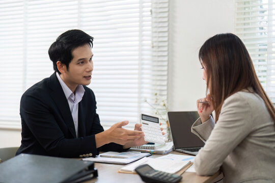 Financial Consultation Session. Advisor presenting financial data and strategies to a client.