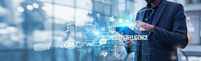 Businessman using tablet analyzing Business Intelligence and driving growth through data insights, improving decision-making, and optimizing business performance for competitive advantage.