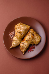 Grilled chicken leg or quarter. Barbecued meat with salt and spices