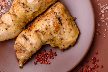 Grilled chicken leg or quarter. Barbecued meat with salt and spices