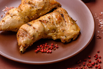 Grilled chicken leg or quarter. Barbecued meat with salt and spices