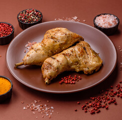 Grilled chicken leg or quarter. Barbecued meat with salt and spices