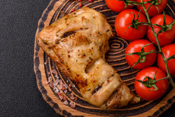 Grilled chicken leg or quarter. Barbecued meat with salt and spices