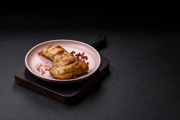 Grilled chicken leg or quarter. Barbecued meat with salt and spices