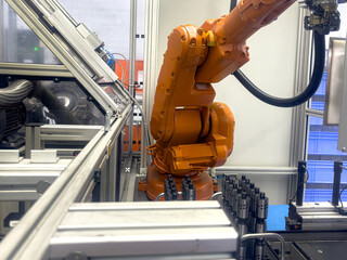 Innovative robotic arm engages in precision manufacturing within a high-tech facility during daylight hours