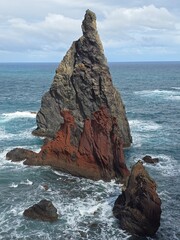 Solitary sea stack off Ribeira da Janela pierces the Atlantic horizon. This ancient sentinel of...