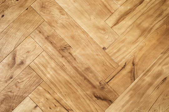 Natural wooden oak parquet flooring background. Rustic floor pattern for interior and indoor home design top view.