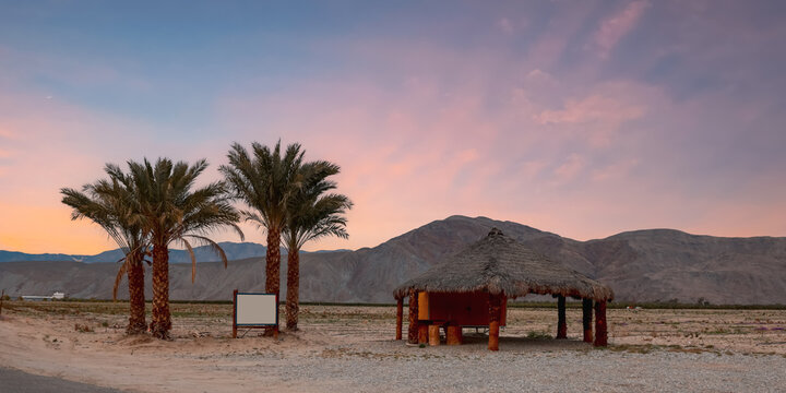 Anza Borrego desert state park in California. Wooden sign board and hut during twilight.