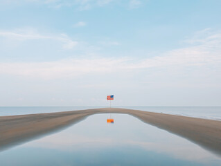 Beach Flag Reflection with Calm Ocean.