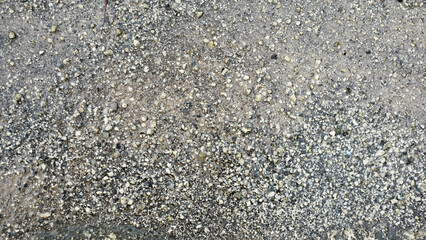 Background of Gravel Texture with Small Stones on a Sandy Surface